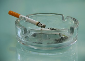 Image showing Cigarette and ash tray