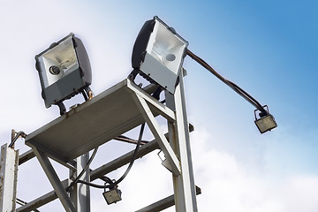 Image showing stadium lights against a blue sky 