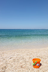 Image showing beautiful beach with child's bucket