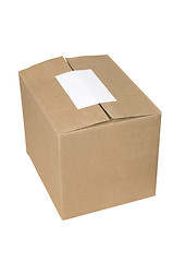 Image showing closed shipping cardboard box whit white empty label