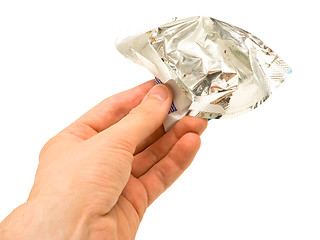 Image showing Crumpled wrapper in hand