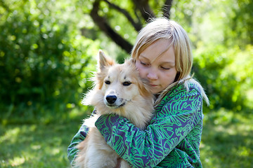 Image showing Girl with pet dog