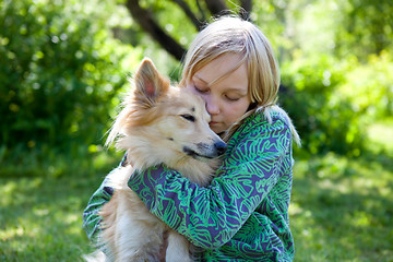 Image showing Girl with pet dog