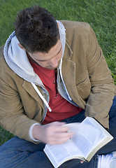 Image showing Young man reading