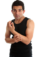 Image showing Man, fitness instructor, builder nursing sore arm