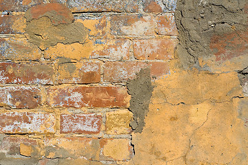 Image showing Old plaster on brick wall