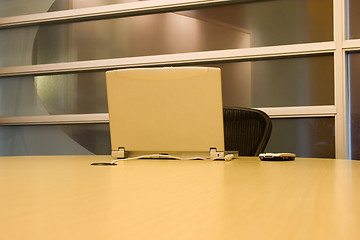 Image showing Conference Room with a Laptop and a PDA on the table