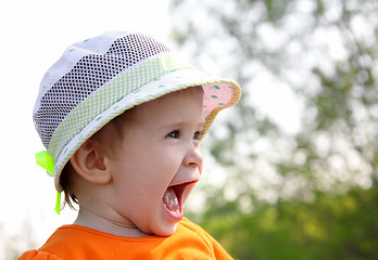 Image showing laughing baby in hat outdoor