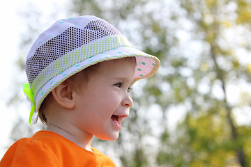 Image showing laughing baby in hat outdoor