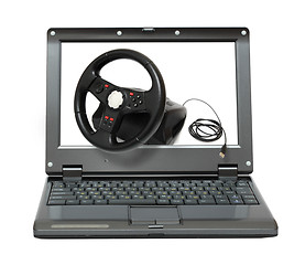 Image showing laptop with gaming car simulator