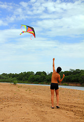 Image showing boy running kite