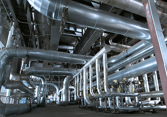 Image showing Equipment, cables and piping as found inside of a modern industr