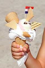 Image showing Creative Ice Cream in hand with flag of Croatia