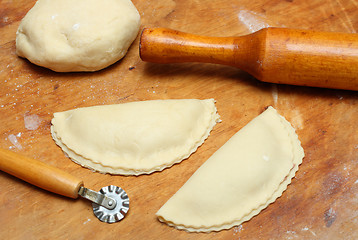 Image showing rolling-pin with patty and pastry