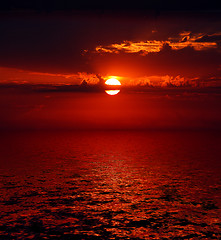 Image showing bloody sunrise over sea