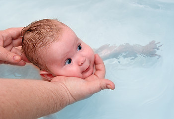 Image showing small baby learn to swimming