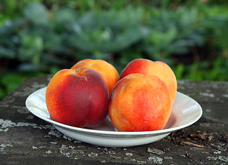 Image showing peaches on old wooden table