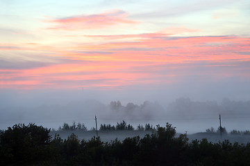 Image showing mist landscape with sunrise over lake