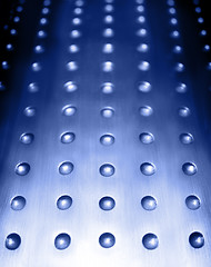 Image showing blue metal surface background with holes