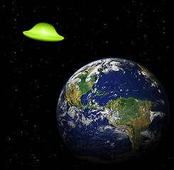 Image showing aliens spaceship near earth planet