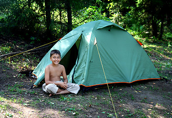 Image showing smiling boy near camping tent