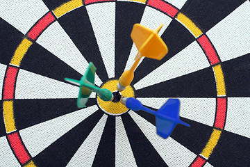 Image showing dartboard with darts in aim