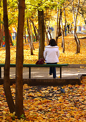 Image showing girl on bench in autumn park