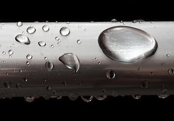 Image showing water drops on misted metal tube