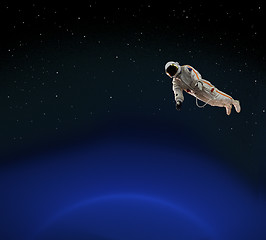 Image showing astronaut over blue planet
