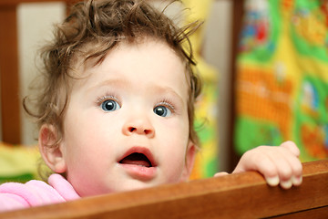 Image showing touching baby looking up