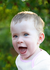 Image showing happy laughing baby outdoor