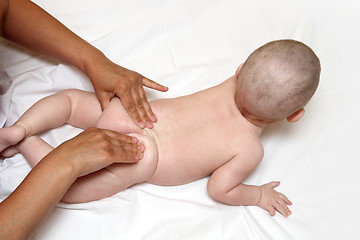 Image showing small baby massaging