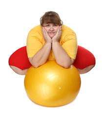 Image showing overweight woman sitting with gym ball
