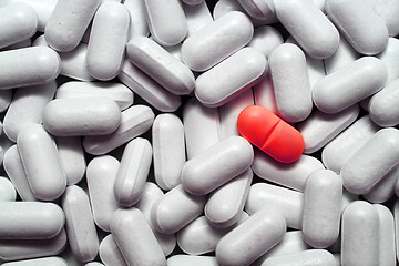 Image showing different - red pill among pills