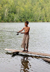 Image showing boy fishing with spinning