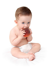 Image showing baby eating peach