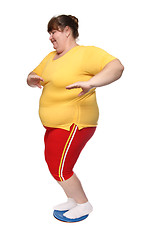 Image showing overweight woman on gymnastic disc