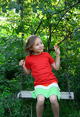 Image showing happy girl on swing