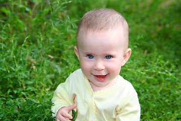 Image showing happy smiling baby in grass
