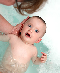 Image showing happy baby girl bath by mother