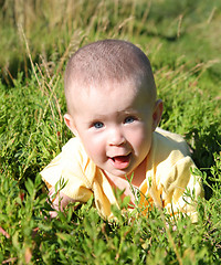 Image showing happy smiling baby in grass