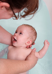 Image showing happy baby girl bath by mother