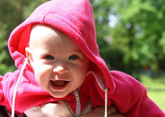 Image showing happy laughing baby outdoors