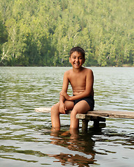 Image showing boy sitting on stage