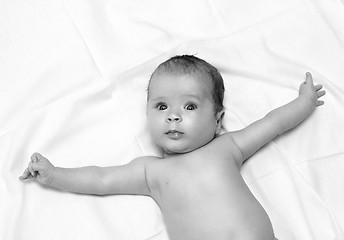 Image showing baby lying on white sheet