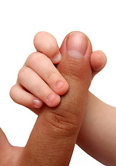 Image showing baby holding father finger