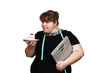 Image showing dieting overweight women with cake