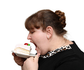 Image showing overweight woman biting cake
