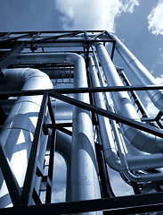 Image showing Industrial zone, Steel pipelines in blue sky