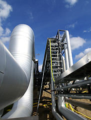 Image showing Industrial zone, Steel pipelines in blue sky